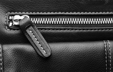 Close up of black leather bag zipper, black leather bag close upの写真素材