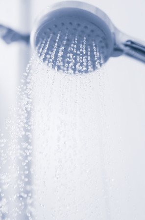 Shower with running water, tinted photoの写真素材