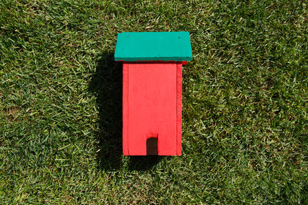Toy house on grass close-upの写真素材