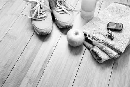 Pair of sport shoes and fitness accessories. Fitness concept. Black and white photoの写真素材
