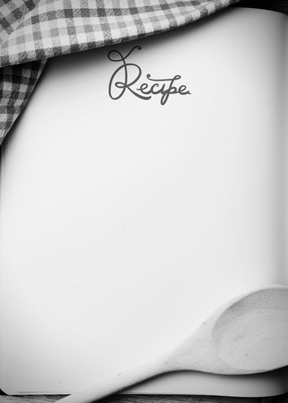 Blank recipe book on wooden table, black and white photoの写真素材