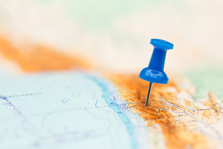 Travel destination, blue  pin on the mapの写真素材