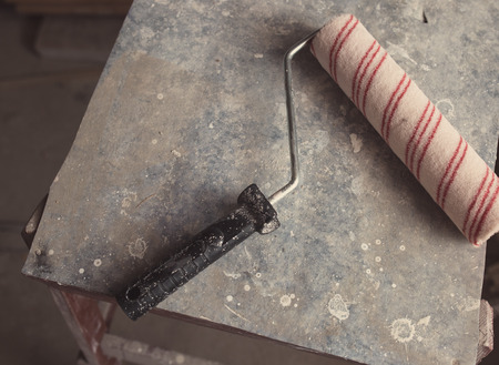 Paint roller with the old backgroundの写真素材