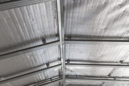 Suspended ceiling of the attic with reflective heat barrier.の写真素材