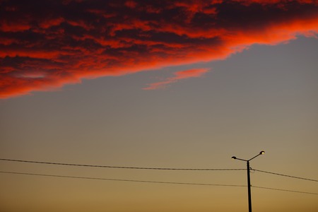 Dramatic and moody pink, purple and blue cloudy sunset sky.の写真素材