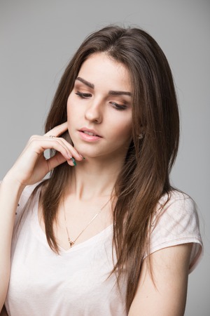 Sensual portrait of beautiful brunette woman posing in studio.の写真素材