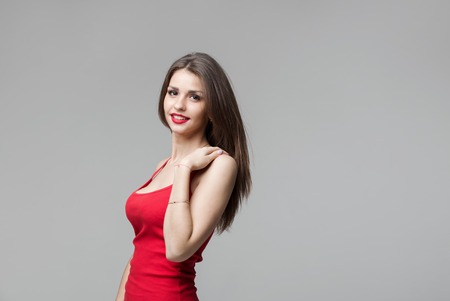 Portrait of beautiful brunette woman posing in studio.の写真素材