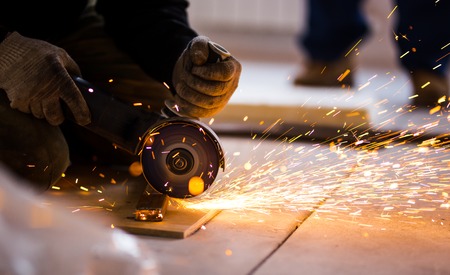 Cutting metal with angle grinder.の写真素材