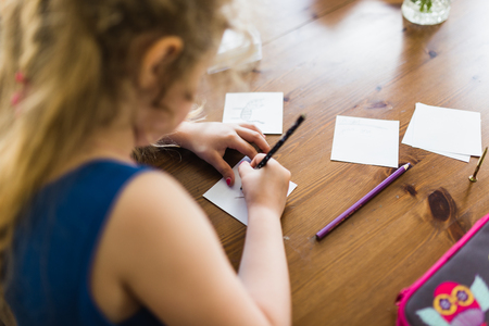 Cute little preschooler child drawing at homeの写真素材