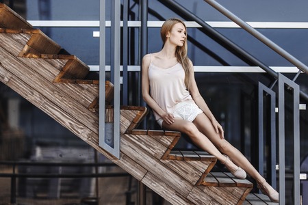 Outdoor summer portrait of fashionable woman in nice dressの写真素材