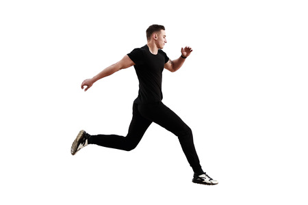 Athletic man running isolated on white background.の写真素材