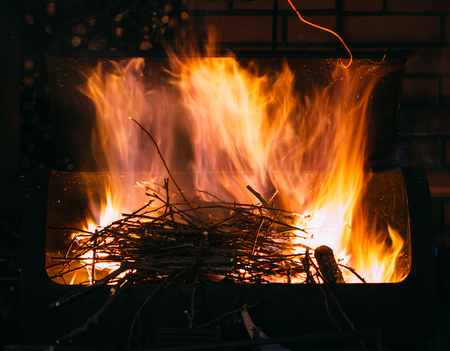 Burning firewood and branches for coal, long exposure photo of fireの写真素材