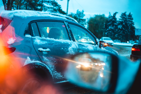 Car traffic in the early winter morning, view from the car windowの写真素材
