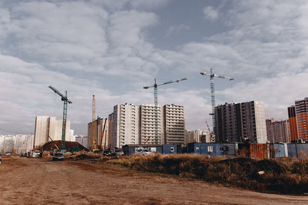 View of the construction site with cranes and high-rise residential buildingsの写真素材