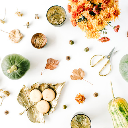 autumn fall flat lay, top view arrangement. chrysanthemum bouquet, pumpkin, leaves, golden scissors on white background, flat lay, top viewの写真素材
