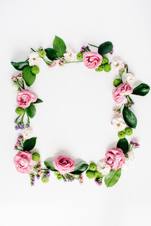 round frame wreath pattern with roses, pink flower buds, branches and leaves isolated on white background. flat lay, top viewの写真素材