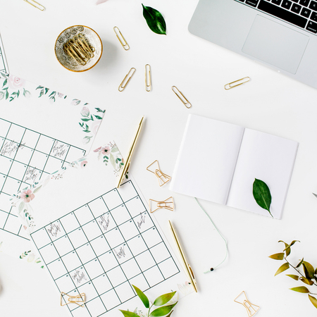 wedding planner schedule calendar painted with watercolor, laptop, notebook and accessories. flat lay workspace, top viewの写真素材