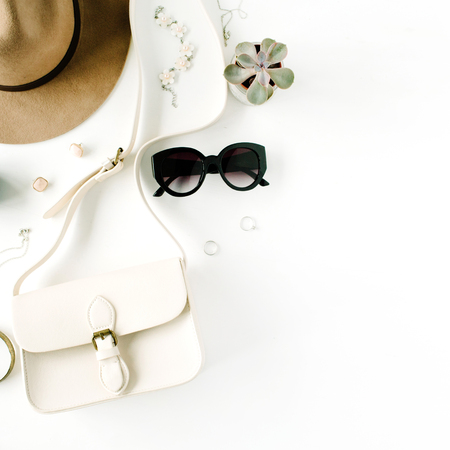 Flat lay trendy creative feminine accessories arrangement. Purse, hat, sunglasses, female accessories. Top viewの写真素材