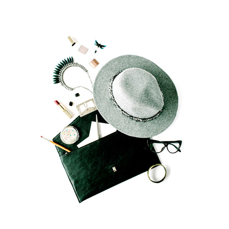 beauty feminine accessories arrangement with hat, purse, glasses, lipstick and necklace. flat lay, top viewの写真素材