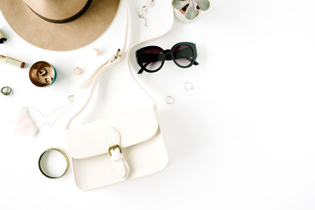 Flat lay trendy creative feminine accessories arrangement. Purse, hat, sunglasses, female accessories. Top viewの写真素材