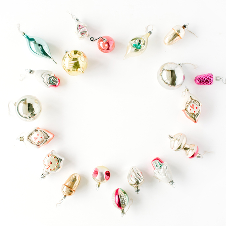 creative arrangement frame of bright christmas balls and toys on white background. flat lay, top viewの写真素材