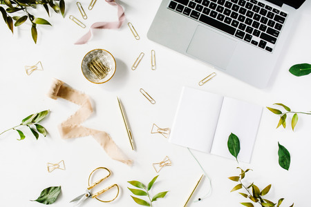 feminine home office workspace with laptop, notebook and accessories. flat lay, top viewの写真素材