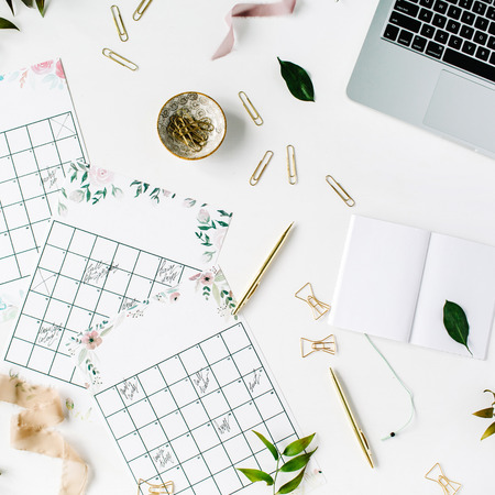 wedding planner schedule calendar painted with watercolor, laptop, notebook and accessories. flat lay workspace, top viewの写真素材