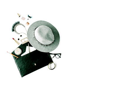 beauty feminine accessories arrangement with hat, purse, glasses, lipstick and necklace. flat lay, top viewの写真素材