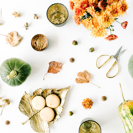 autumn fall flat lay, top view arrangement. chrysanthemum bouquet, pumpkin, leaves, golden scissors on white background, flat lay, top viewの写真素材