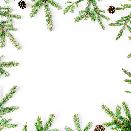 Christmas composition with frame of fir branches and pine cones. Flat lay, top viewの写真素材