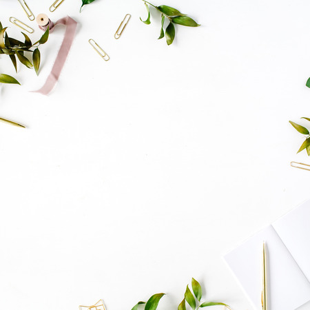 feminine home office workspace mockup with branches, golden pen, clips and beige ribbon. flat lay, top viewの写真素材