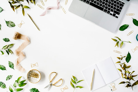 feminine home office workspace with laptop, notebook and accessories. flat lay, top viewの写真素材