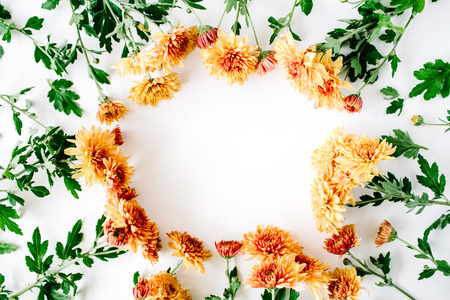 round frame wreath pattern with chrysanthemum, branches and leaves isolated on white background. flat lay, top viewの写真素材