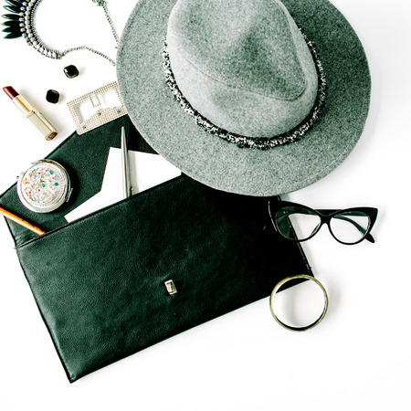 beauty feminine accessories arrangement with hat, purse, glasses, lipstick and necklace. flat lay, top viewの写真素材