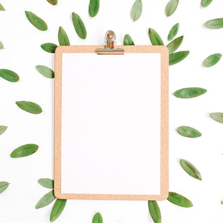 clipboard with green petals isolated on white background. flat lay, top viewの写真素材