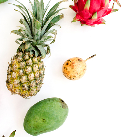 Exotic fruits: mango, pineapple, passion fruit and dragon fruit. Flat lay, top viewの写真素材