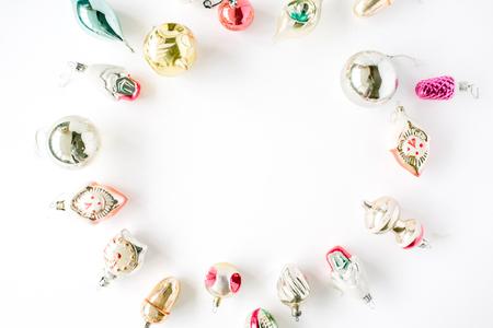 creative arrangement frame of bright christmas balls and toys on white background. flat lay, top viewの写真素材