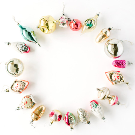 creative arrangement frame of bright christmas balls and toys on white background. flat lay, top viewの写真素材