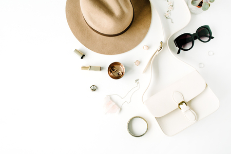 Flat lay trendy creative feminine accessories arrangement. Purse, hat, sunglasses, female accessories. Top viewの写真素材