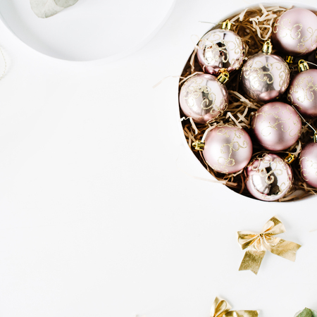 frame made of christmas decoration with christmas glass balls, tinsel, bow, eucalyptus. christmas wallpaper. flat lay, top viewの写真素材