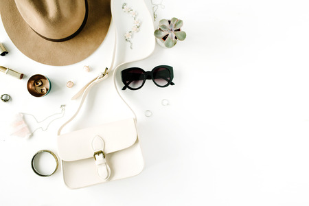 Flat lay trendy creative feminine accessories arrangement. Purse, hat, sunglasses, female accessories. Top viewの写真素材