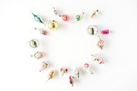 creative arrangement frame of bright christmas balls and toys on white background. flat lay, top viewの写真素材