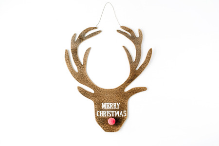 words merry christmas and toy head of christmas deer on white background. flat lay, top viewの写真素材