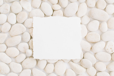 Blank with copy space on neutral pattern of beige stones. Flat lay, top viewの写真素材