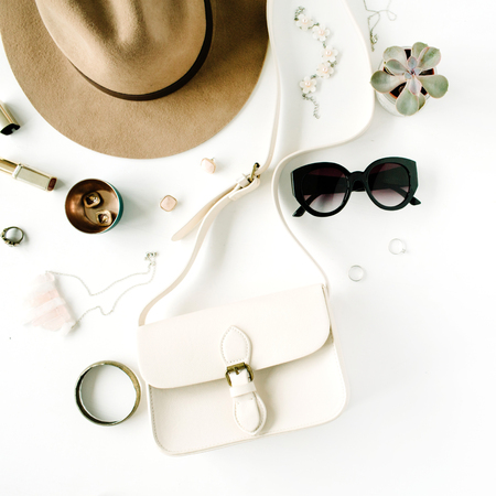 Flat lay trendy creative feminine accessories arrangement. Purse, hat, sunglasses, female accessories. Top viewの写真素材