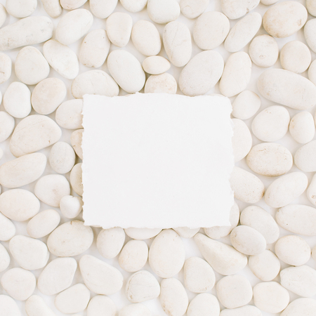 Blank with copy space on neutral pattern of beige stones. Flat lay, top viewの写真素材