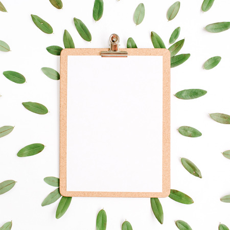 clipboard with green petals isolated on white background. flat lay, top viewの写真素材