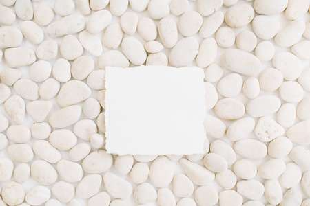 Blank with copy space on neutral pattern of beige stones. Flat lay, top viewの写真素材
