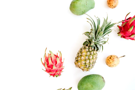 Exotic fruits: mango, pineapple, passion fruit and dragon fruit. Flat lay, top viewの写真素材