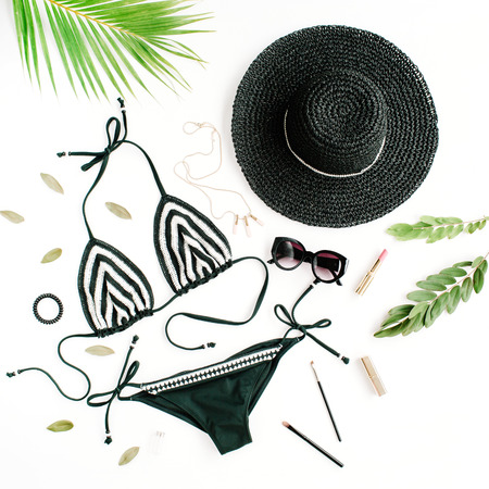 female summer bikini swimsuit accessories collage on white with hat, green branches, necklace and sunglasses. flat lay, top viewの写真素材